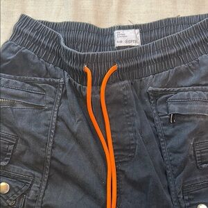 Stylish Black Cargo Pants with Vibrant Orange Drawstring
